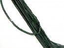 Green, glittering, pierced sandstone hearts