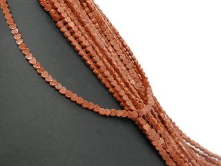 Red, glittering, pierced gold sand hearts