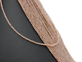 Facettierte, durchbohrte, braune Mondsteine