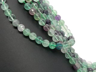 Fluorites percées, violettes et vertes avec facettes