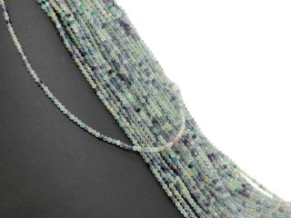 Pierced, violet, green and yellow fluorites with facets