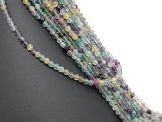 Pierced, violet, green and yellow fluorites with facets