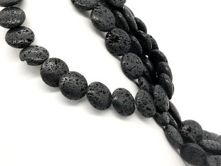 Pierced, black lava discs