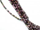 Dark, pierced tourmaline beads