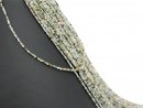 Mixed, green gemstones with facettes
