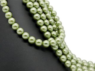 Grüne, durchbohrte Muschelkernperlen