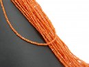 Pierced, orange, faceted zircon beads