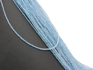 Faceted, blue, pierced topaz spheres