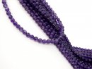 Purple, pierced amethyst beads