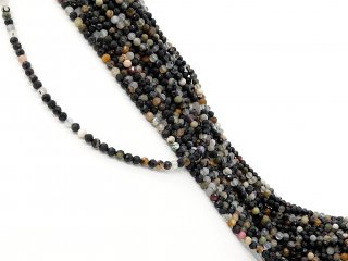 Mixed, colourful, pierced gemstones with facets