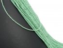 Pierced, faceted angelite beads in green