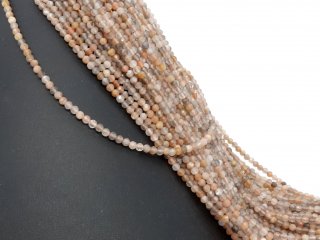 Brown, white and grey moonstones with facets