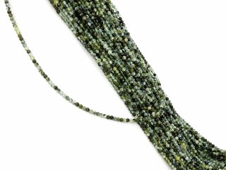 Petites boules de quartz percées à facettes dans les tons vert