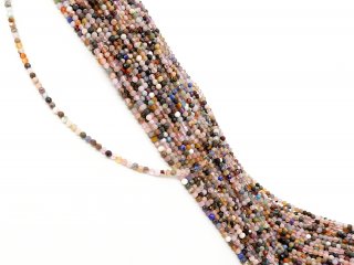 Mixed, colourful, pierced gemstones with facets