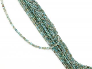 Sparkling, pierced, blue-green apatite spheres