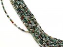 Colourful, faceted, pierced moss agate spheres