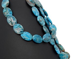 Pierced jasper discs in shades of blue