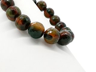 Green-red, faceted, pierced agate spheres