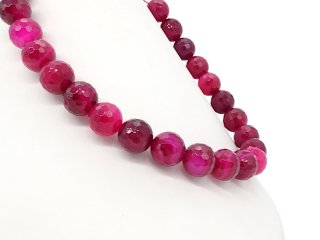 Pink, faceted, pierced agate spheres