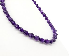 Curved, pierced amethyst beads