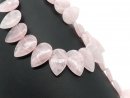 Pierced, teardrop-shaped rose quartz discs