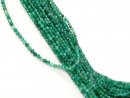 Small, drilled quartz spheres with facets in green