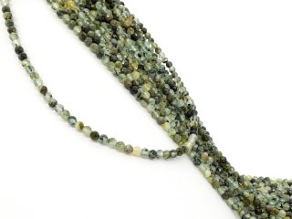 Small, drilled quartz spheres with facets in green
