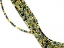 Small, drilled quartz spheres with facets in green