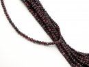 Faceted, pierced, dark red garnet beads