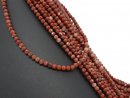 Brick red, pierced, faceted jasper beads
