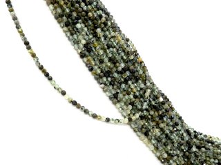 Small, drilled quartz spheres with facets in green