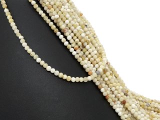 Mixed, yellow, pierced gemstones with facets