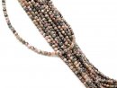 Durchbohrte, facettierte Rhodonite in Rosa und Braun