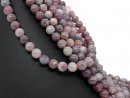 Pierced rose quartz beads in mauve, purple and orange
