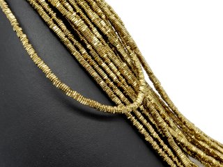 Pierced, golden hematite discs