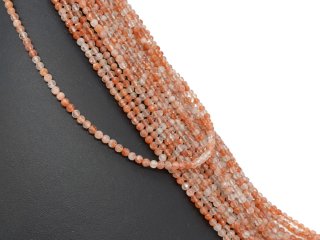 Facettierte, durchbohrte und orangefarbene Sonnensteine