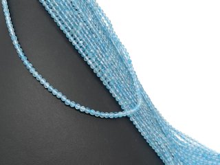 Faceted, blue, pierced topaz spheres