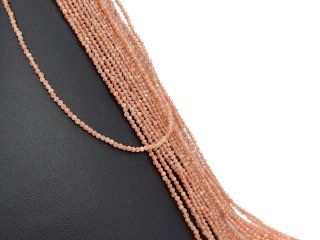 Faceted, pierced and orange-coloured sunstones