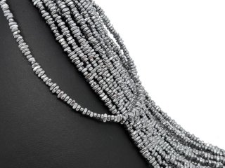 Pierced, grey hematite discs