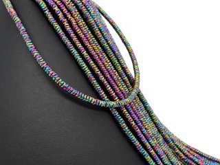 Pierced, colourful haematite discs