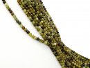 Pierced green garnet beads