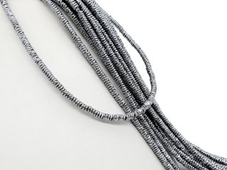 Durchbohrte, hellgraue Hämatit-Scheiben