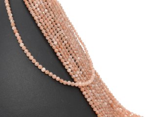 Faceted, pierced and orange-coloured sunstones