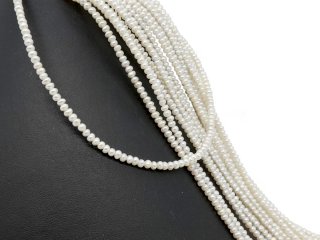 Button-shaped, white, loose cultured pearls with drill hole