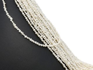 Pierced, baroque, small cultured pearls in white