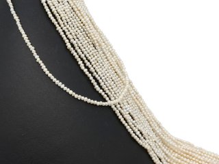 Pierced, baroque, small cultured pearls in white