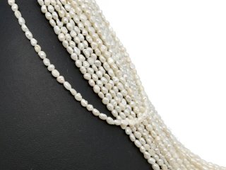 Pierced, baroque, small cultured pearls in white