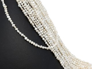 Pierced, baroque, small cultured pearls in white