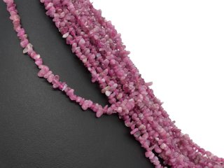 Pierced, magenta-coloured tourmaline beads