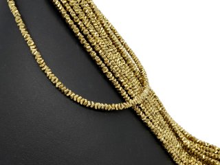 Durchbohrte, goldene Hämatitscheiben